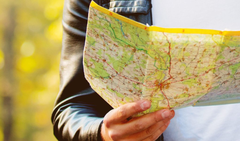 A road map held open in both hands