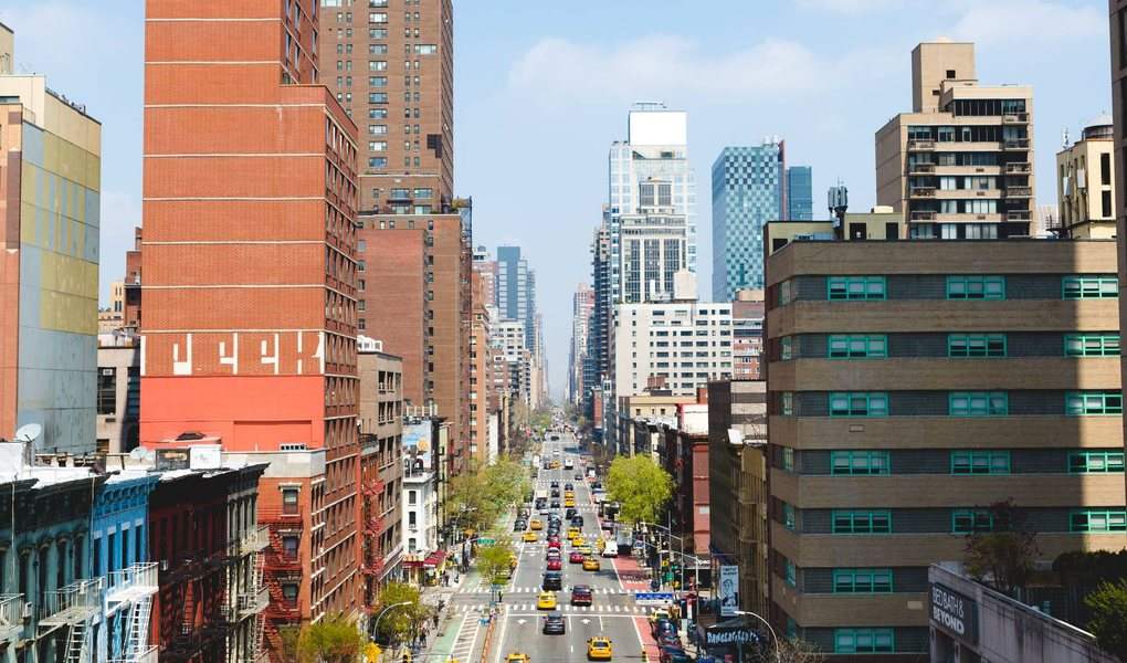 A Manhattan avenue seen between skyscrapers