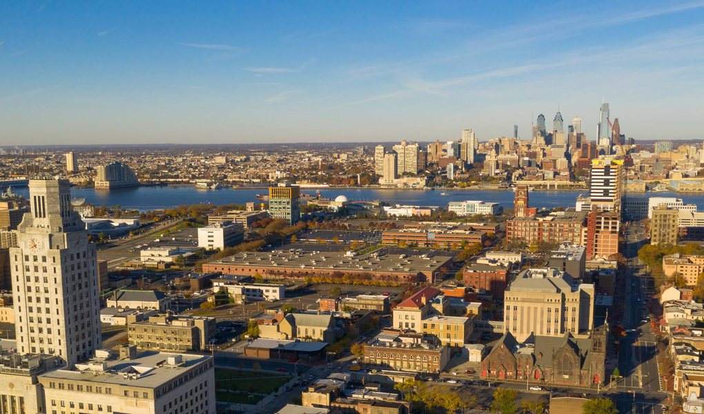 Aerial view over a New Jersey city toward the downtown skyline