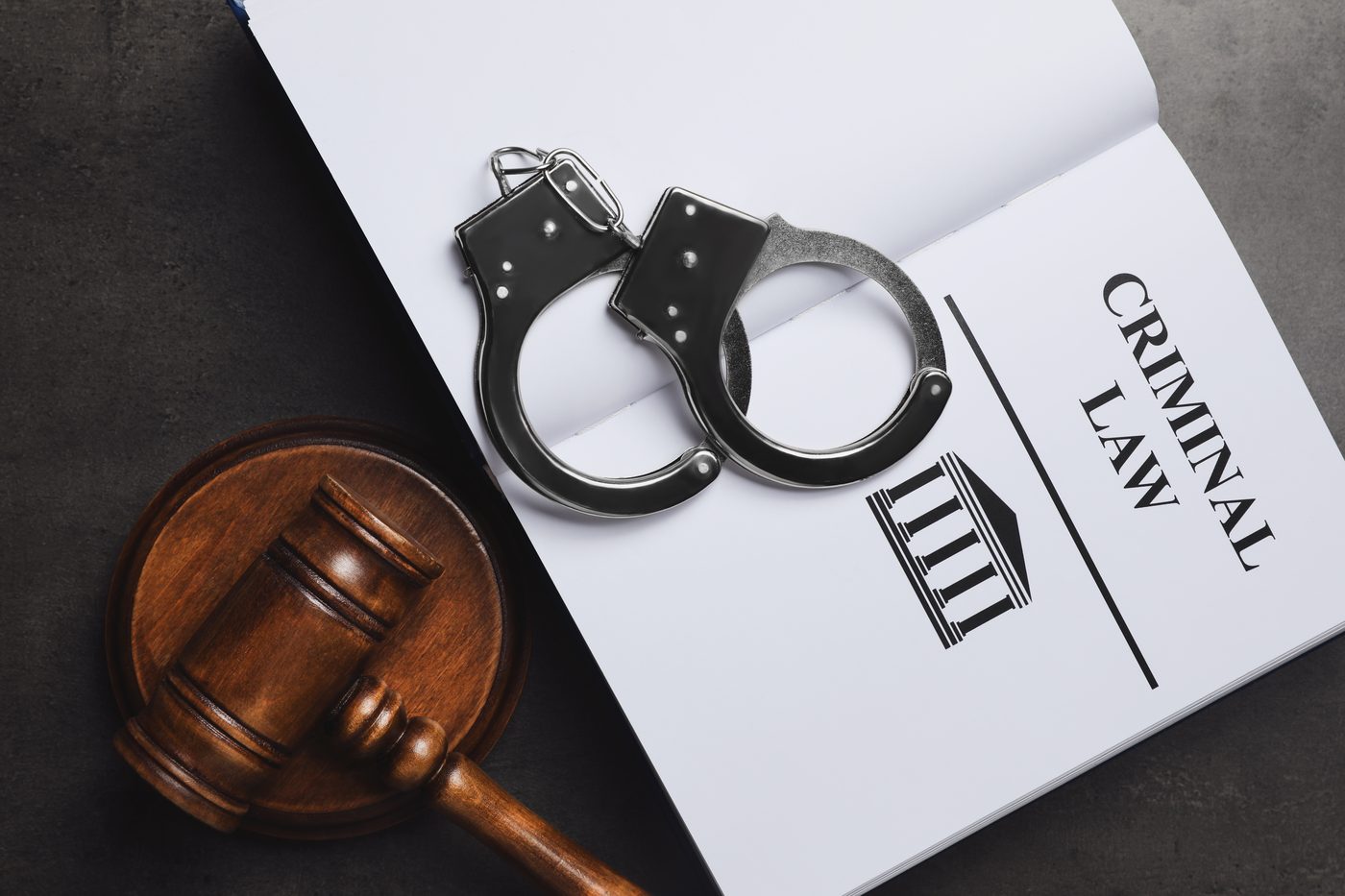 A gavel resting on a law book