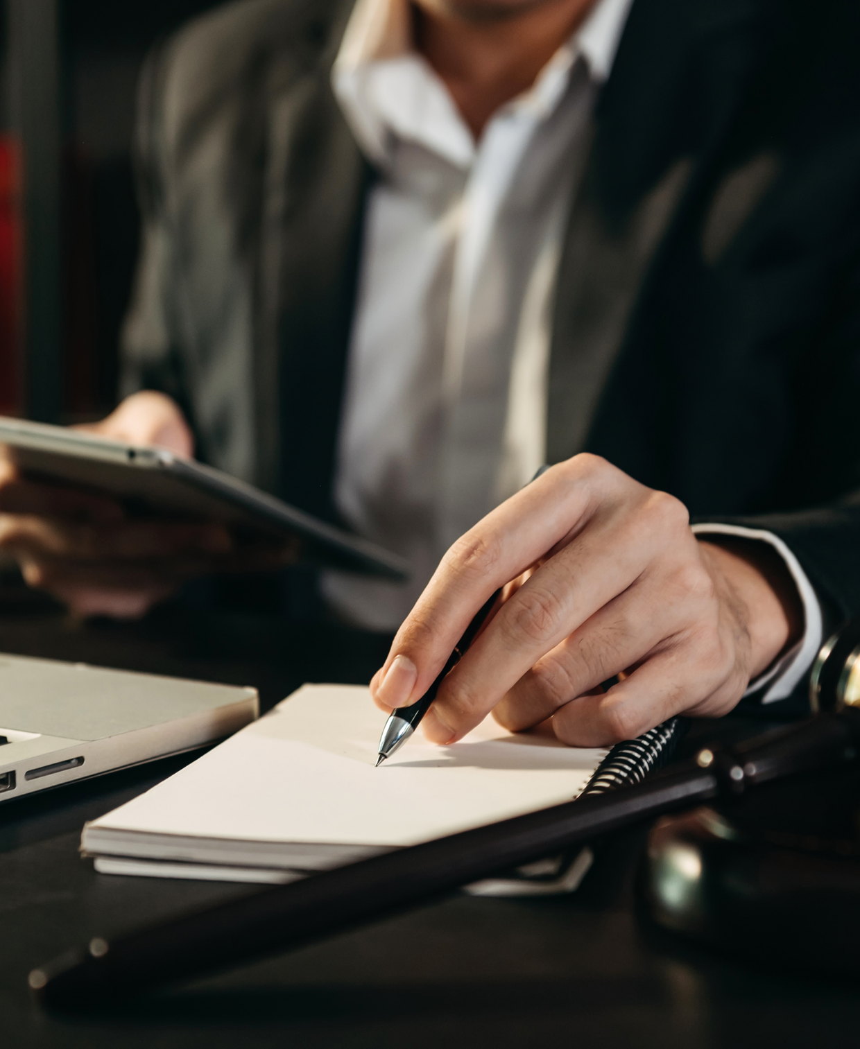 An attorney making notes on a case file at a desk &mdash; Jersey City criminal defense