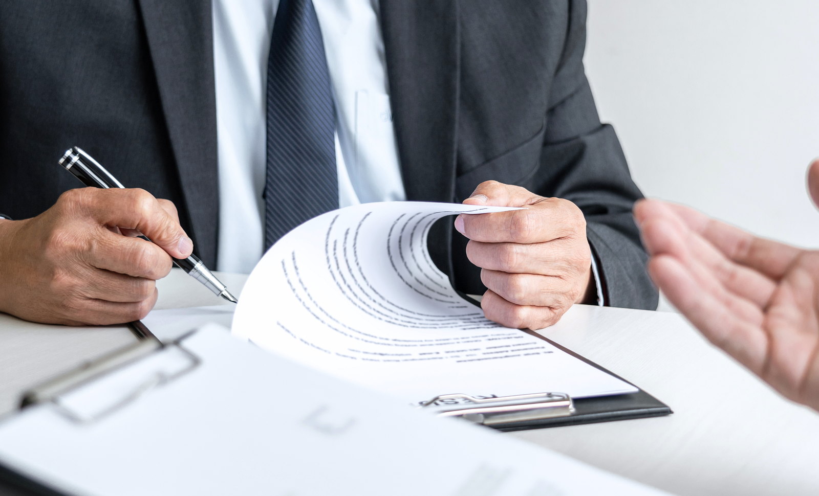 Case papers being reviewed and signed at a desk