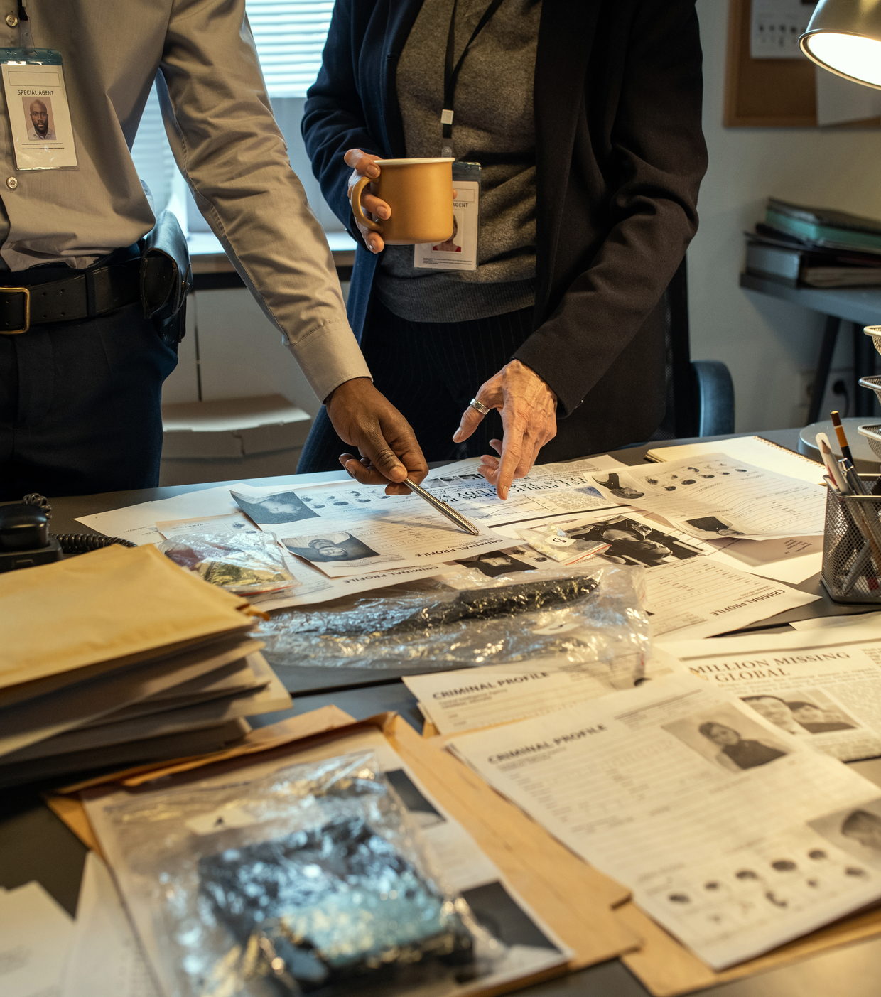 Investigators going through case files and evidence bags